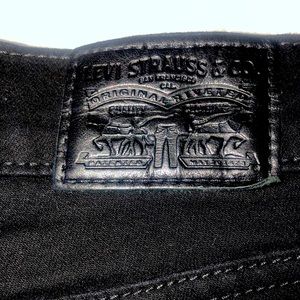 Levi’s black super skinny jeans.